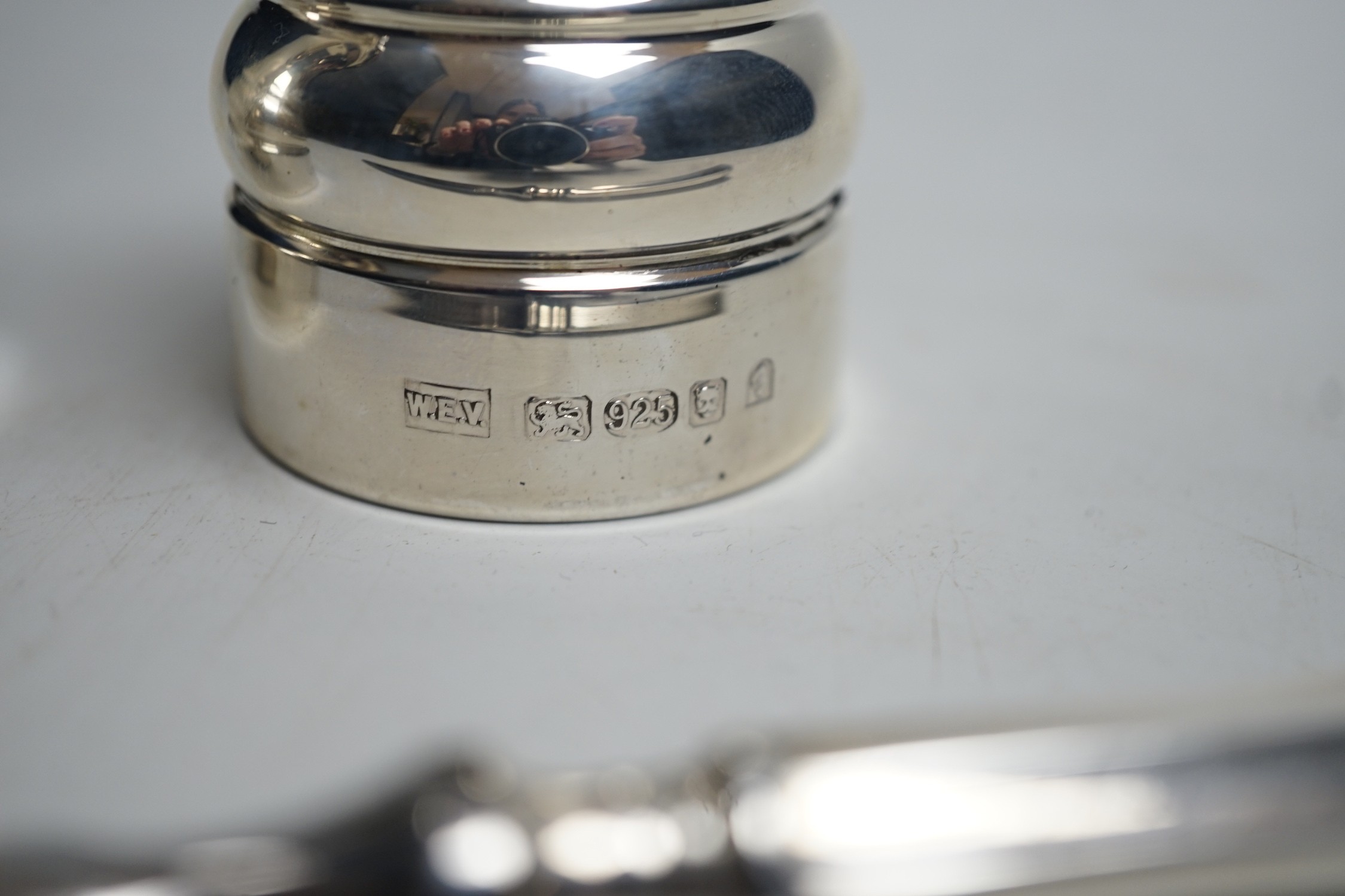 A modern pair of silver mounted salt and pepper mills, boxed, 10.2cm, maker, W.E.V, together with a boxed modern silver handle paper knife.